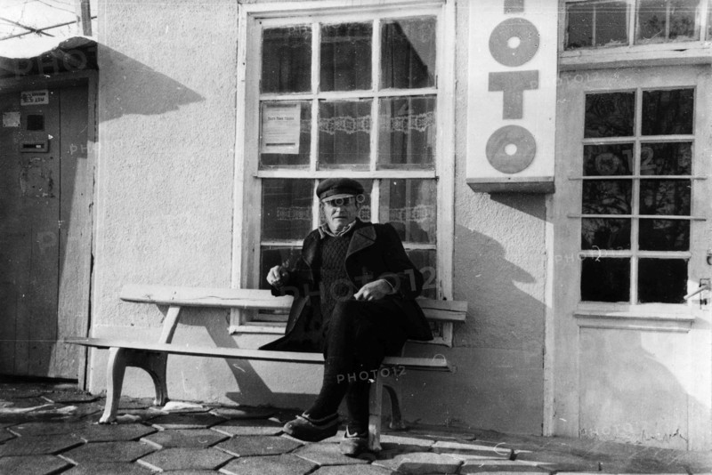 A man sitting on a bench.