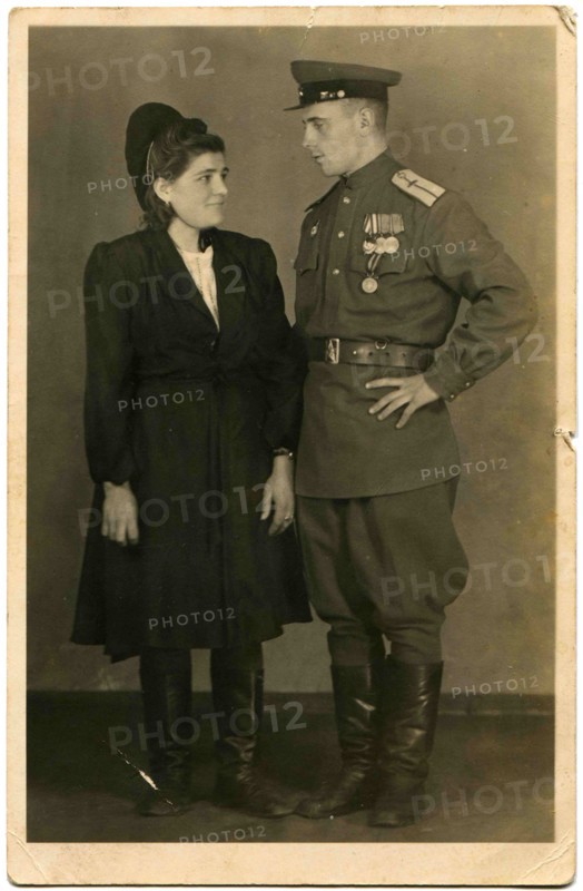 A military pilot who was awarded the Order of the Red Banner, and three medals and a young woman.