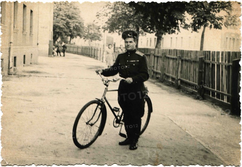 Captain of the Soviet Army with bicycle.