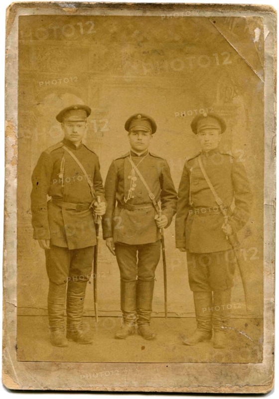 Three soldiers with swords.