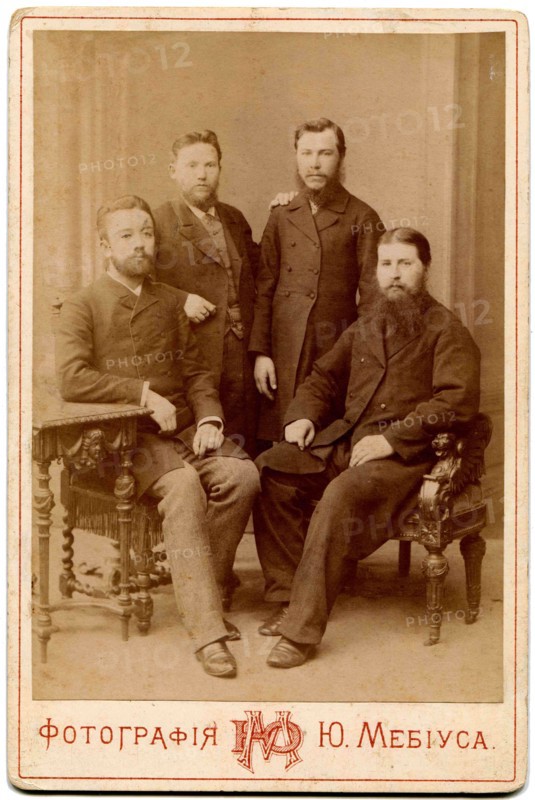 Four of the clergy in secular clothes.