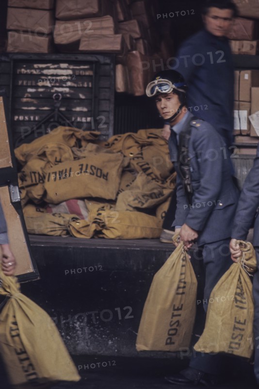 Sacks of poste italiane in railway station, milan, italy, 70's