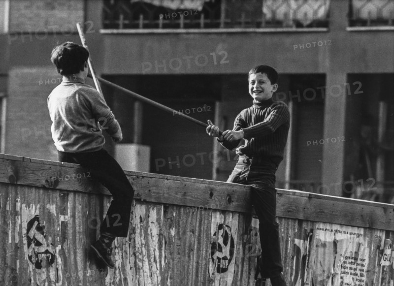 Children playing on a wall, 70's