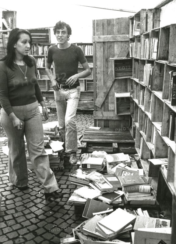 Young people in a used books store, milan, 60's