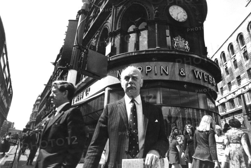 People before the mappin &amp; webb building on poultry in london, uk, 70's
