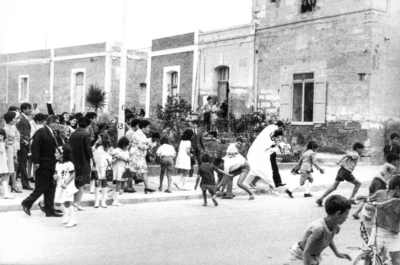 Children collecting candy just launched at the bride, 60's