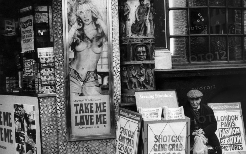 Uk, london, street vendor of evening standard newspaper, 70's