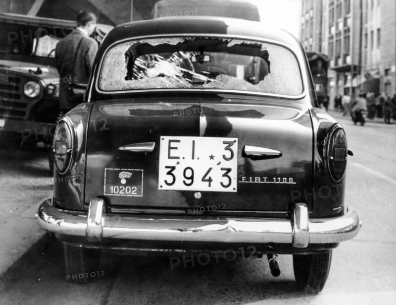 Car of the police destroyed by protesters, Rome, 1966