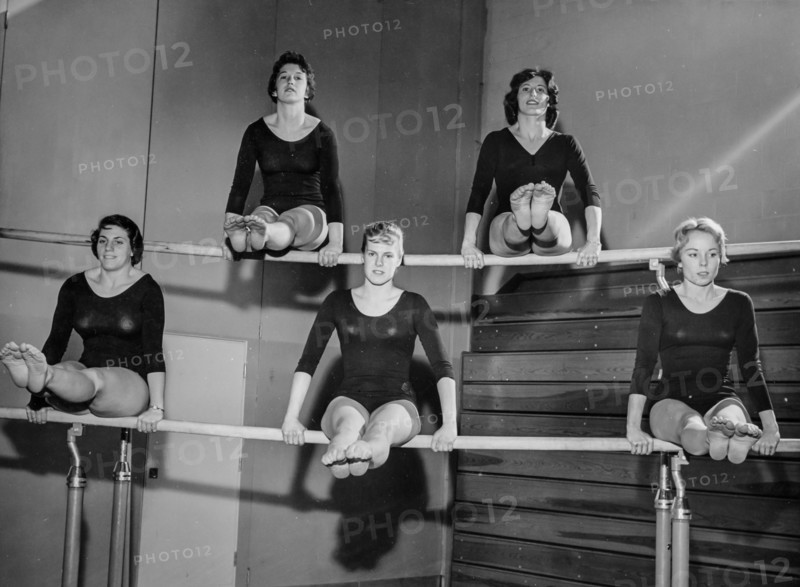 Gymnasts on the uneven bars, 1962