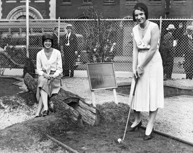 Women Playing Miniature Golf
