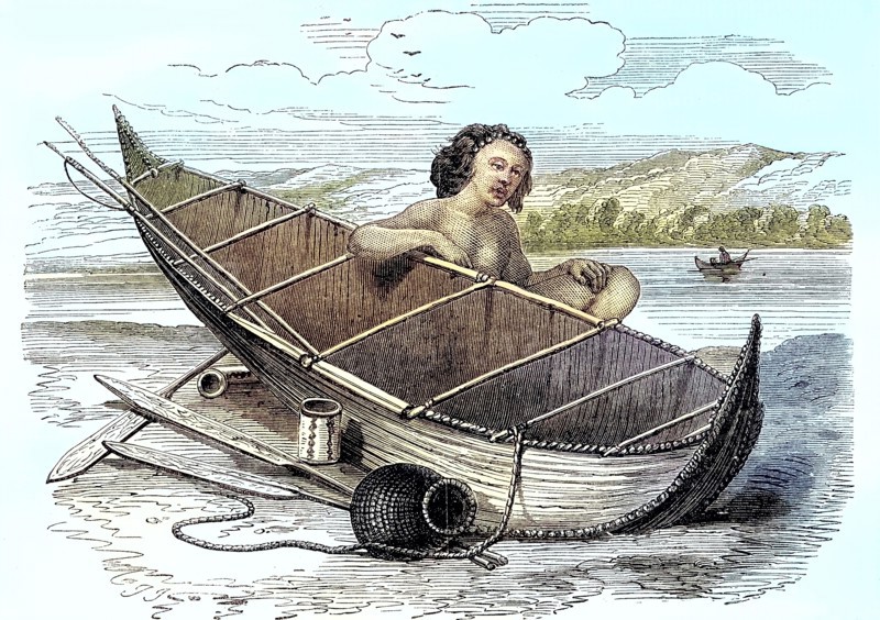 Woman with a canoe on Tierra del Fuego