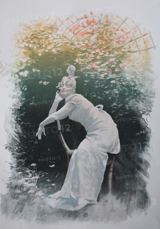 Woman Sitting On A Chair In The Garden And Enjoying The Sunshine
