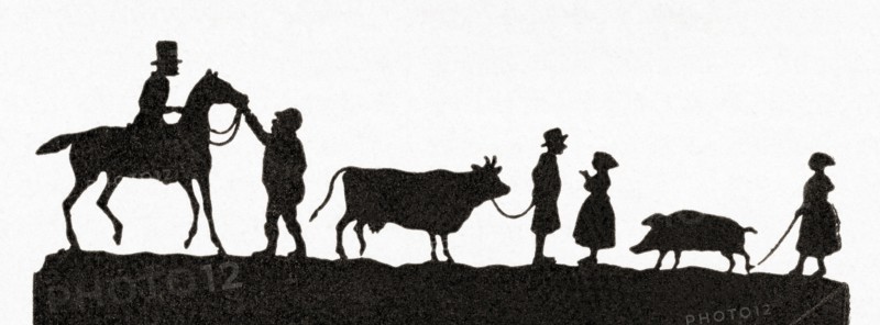 Paper silhouette depicting people taking their animals to market.