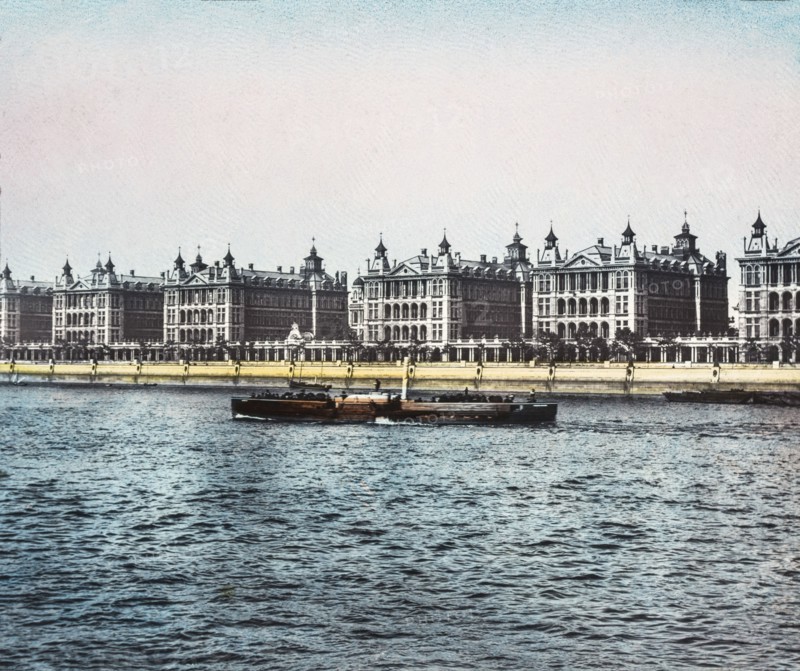 St Thomas Hospital view across the Thames as a pleasure steamer passes.
