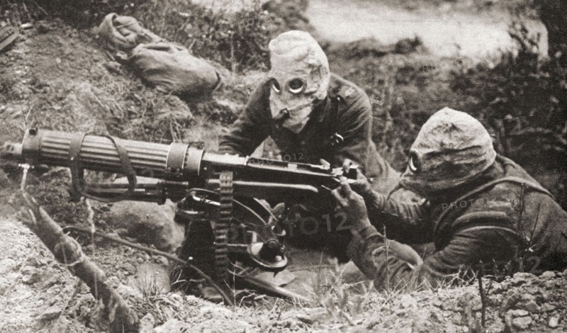Two soldiers wearing respirators to protect them from poison gas during WWI.