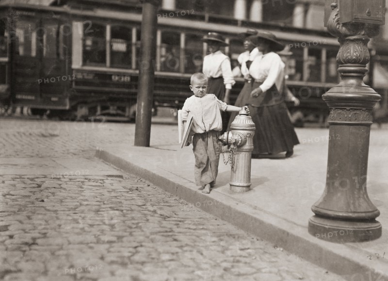 Child newspaper vendor.