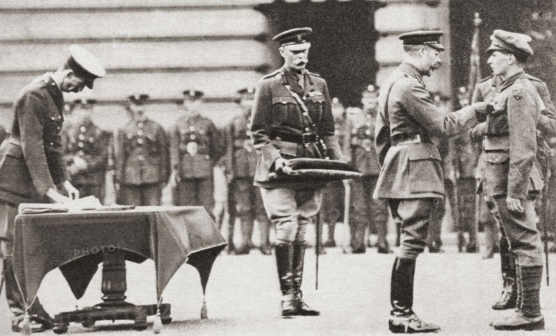 King George V awarding a soldier the Victoria Cross.