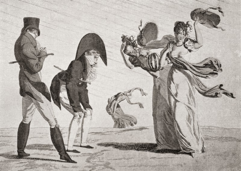 Two ladies lose their hats on a windy day.