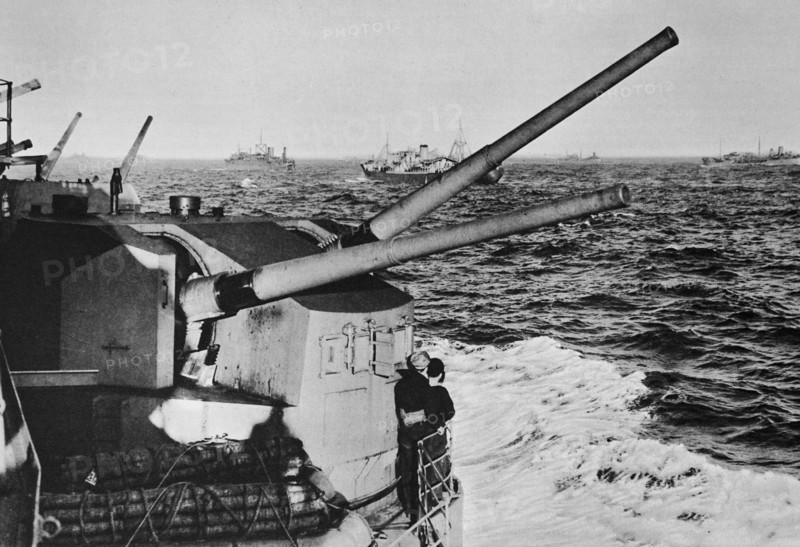 Mr Churchill's battleship the Prince of Wales passing a large convoy in the mid Atlantic.