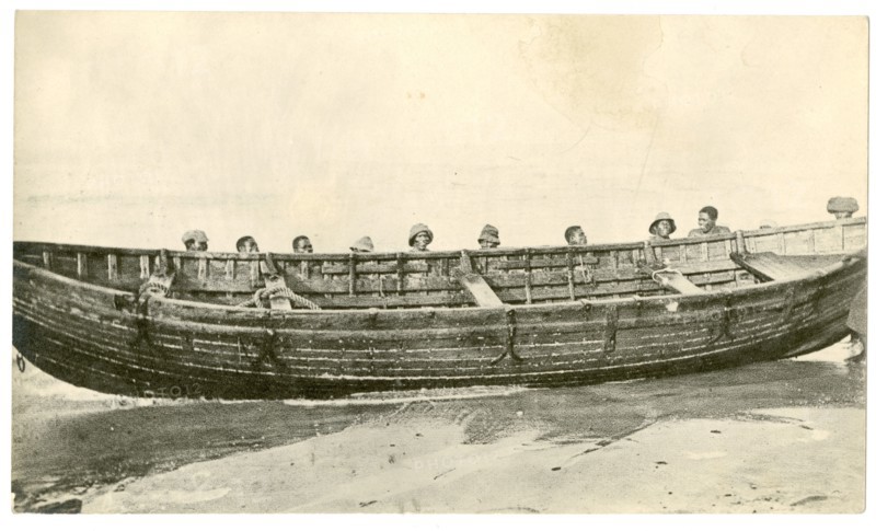 Wooden boat at water's edge