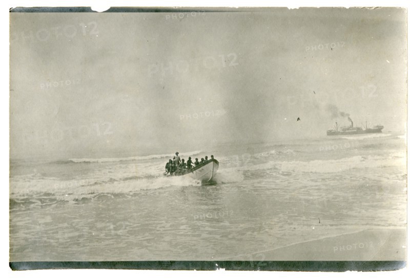 Rowing boat off the coast