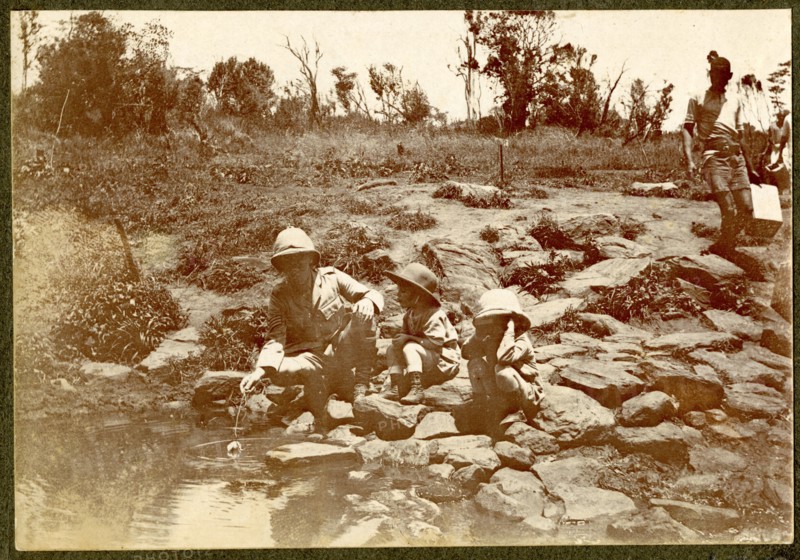 African man by river rapids