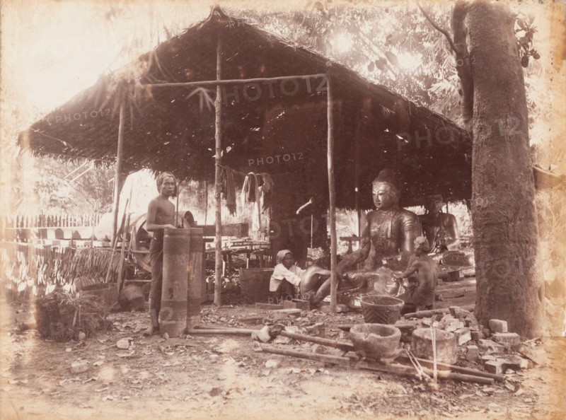 Burmese craftsmen making Buddha sculptures