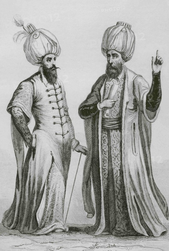 Functionaries of the Ottoman Empire. Janissary Agha (left) top Ottoman military official) and Kadi Lechken (right) ruling judge of the Turkish territories). Engraving by Lemaitre, Masson and Monnin. Historia de Turquia, by Joseph Marie Jouannin (1783-1844) and Jules Van Gaver, 1840.