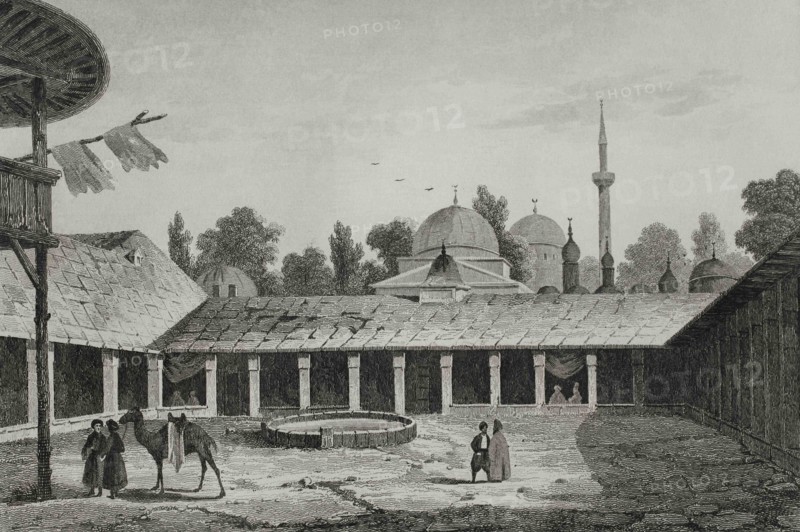 Ottoman Empire period. Caravanserai in Burgas (today territory of Bulgaria). Couryard of the Caravanserai, resting place for travelers. Engraving by Lemaitre, Vormser and Cholet. Historia de Turquia by Joseph Marie Jouannin (1783-1844) and Jules Van Gaver, 1840.