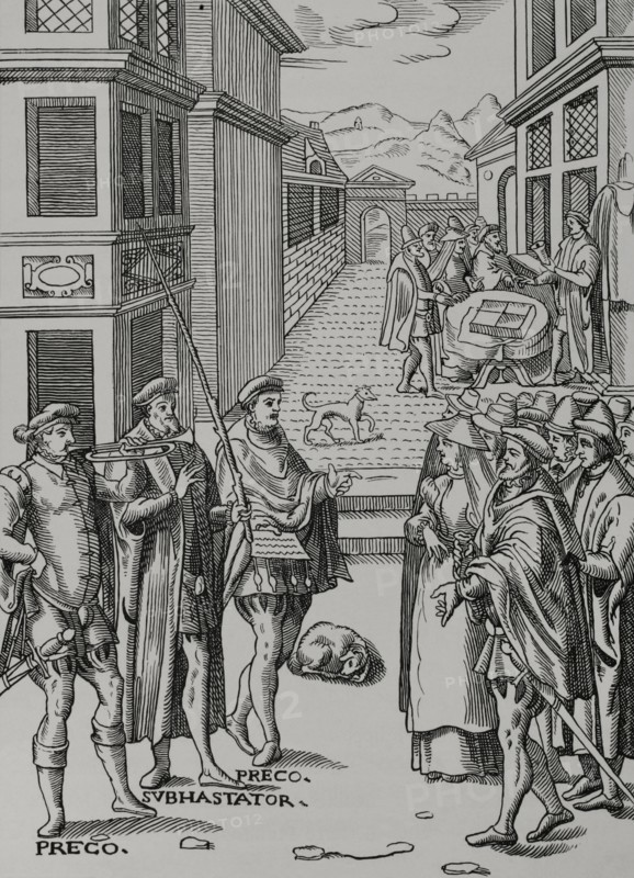 Auction sale. The town crier blowing his trumpet and the auctioneer, the public official in charge of the sale. Another sale in the background, at the sound of the bell. Engraving after a woodcut in ""Praxis Rerum Civilium"", by Joost de Damhouder (1507-1581). Published Antwerp, 1557. ""Moeurs, usages et costumes au moyen-age et a l'epoque de la Renaissance"", by Paul Lacroix. Paris, 1878.