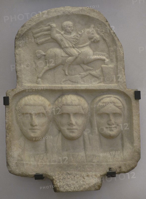 Family group: busts of two bearded men and a woman. Above: relief depicting Heros, the Thracian horseman. Stele. First half of the 3rd century AD. From Vranya, Blagoevgrad region, Bulgaria. National Archaeological Museum. Sofia. Bulgaria.
