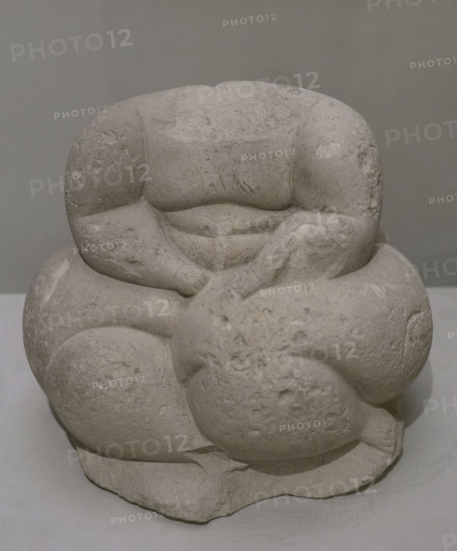 Headless sculpture of a seated human figure. From Hagar Qim, Malta. Temple Period (3600 BC to 2500 BC). National Museum of Archaeology. Valletta. Malta.