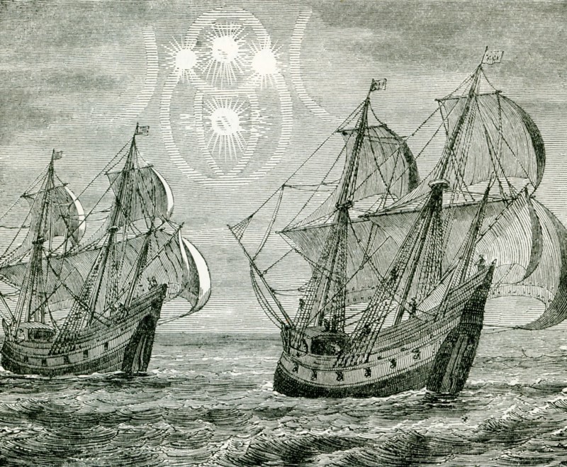 This 1890s illustration show the mock suns as seen by early explorers. Mock suns, also known as sun dogs or sundogs, were formally called a parhelion (plural parhelia) in meteorology. A mock sun is an atmospheric optical phenomenon that consists of a bright spot to one or both sides of the Sun. Two sun dogs often flank the Sun within a 22¬8 halo. .