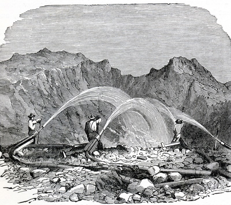 This 1896 illustration shows hydraulic mining being used by gold miners in the far West of the United States. Hydraulic mining is a form of mining that uses high-pressure jets of water to dislodge rock material or move sediment. The practice is an ancient one, but in modern times, it began to be used in the mid-1800s. Its environmental effect is very negative on lands that border rivers and streams. High-pressure water jets have also been used in the underground mining of coal, to break up the coal seam and wash the resulting coal slurry toward a collection point.