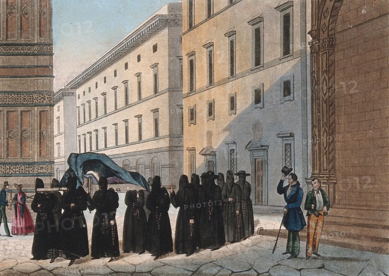 Monks carry a corpse in a religious funeral procession