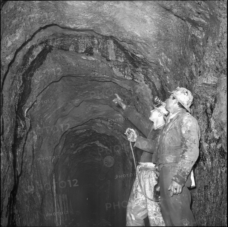 Geologists analysing shaft, Oil deposit; 1964.