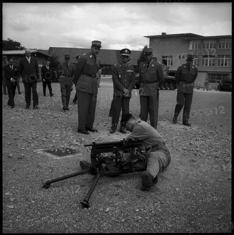 King Bhumibol of Thailand (c) visiting soldiers in Thun, 1960.