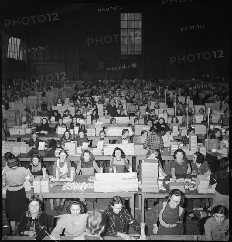 Women preparing parcels, christmas present for soldiers. 1940