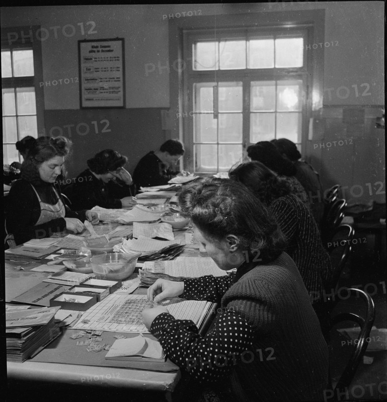 Public administration of food ration cards, coupons, around 1945.