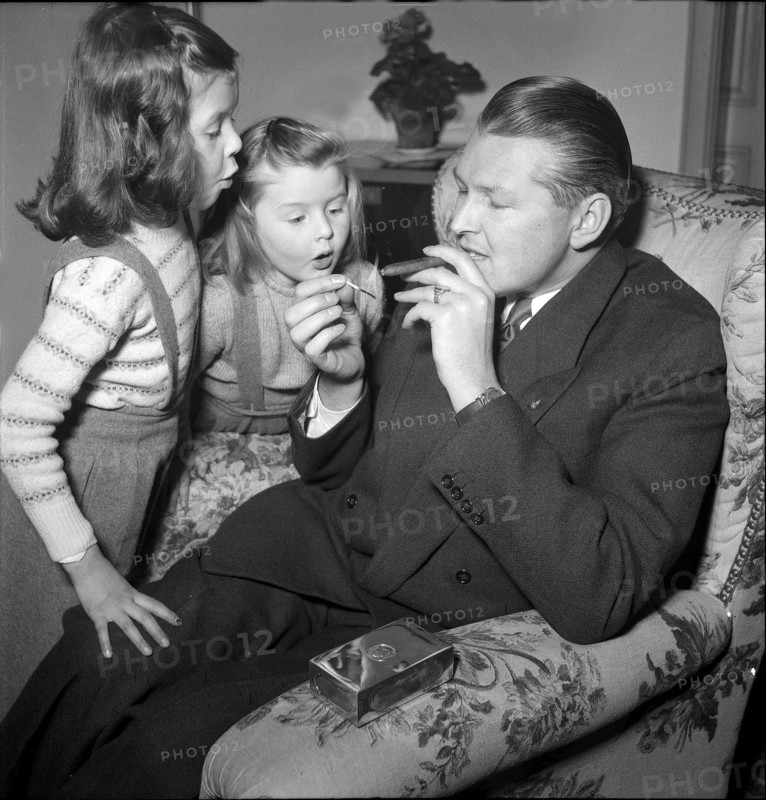 Willy P. Daetwyler, at home with family around 1957.