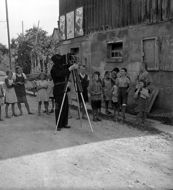 WW 2: bombing in Switzerland; police photographer documenting damage, Dozwil.