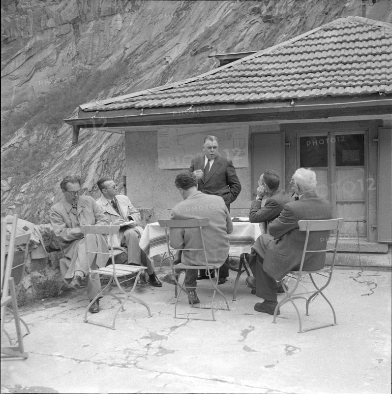 Engineer explaining details on the construction of a bridge in the Schöllenen ravine,  1955.