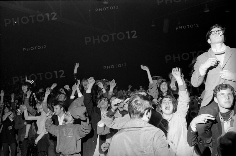 Cheering fans at Rolling Stones concert at Hallenstadion, Zurich 1967 .