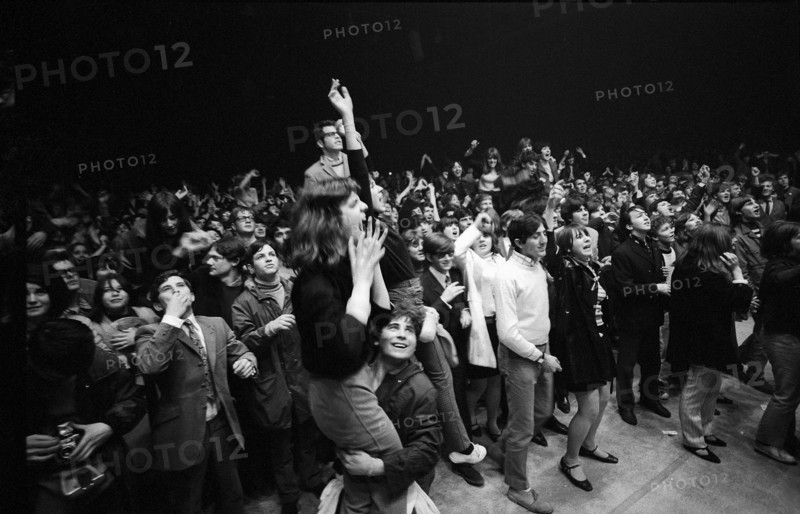Cheering fans at Rolling Stones concert at Hallenstadion, Zurich 1967 .