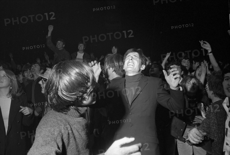 Cheering fans at Rolling Stones concert at Hallenstadion, Zurich 1967 .