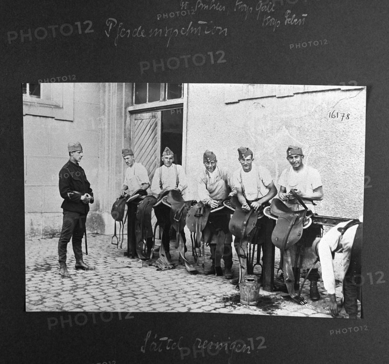 Horse inspection, cleaning the saddles. ca. 1918