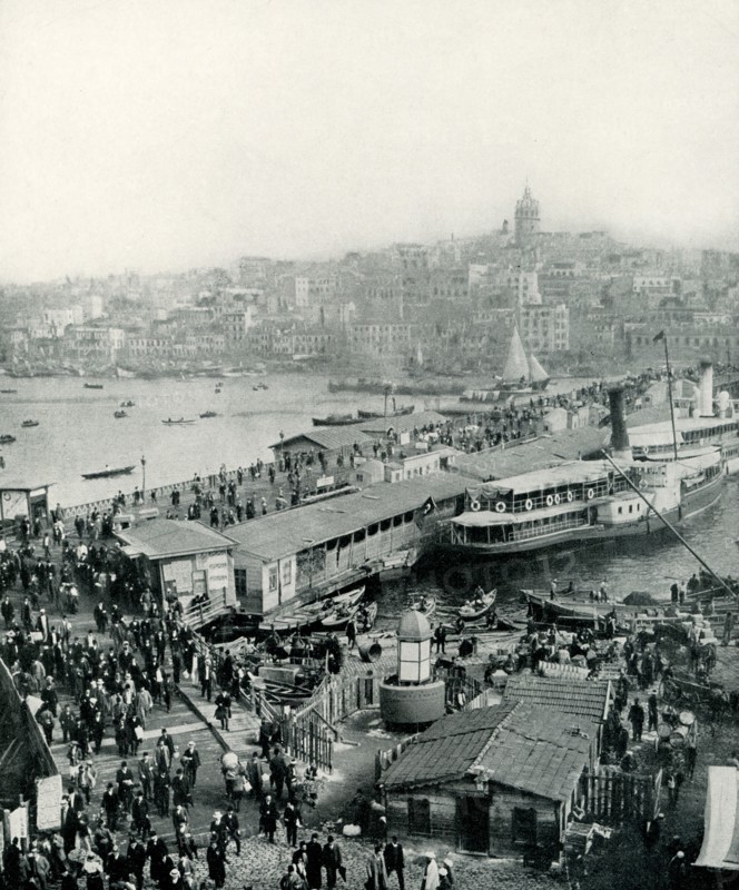 This photo from 1913 shows the Galata Bridge in Constantinople (presnet-day Istanbul) in Turkey that connects Galata and Pera. The Galata Bridge is a bridge that spans the Golden Horn in Istanbul, Turkey. From the end of the 19th century in particular, the bridge has featured in Turkish literature, theater, poetry and novels. The bridge connects Europe and Asia., early 1900s, early 20th century.