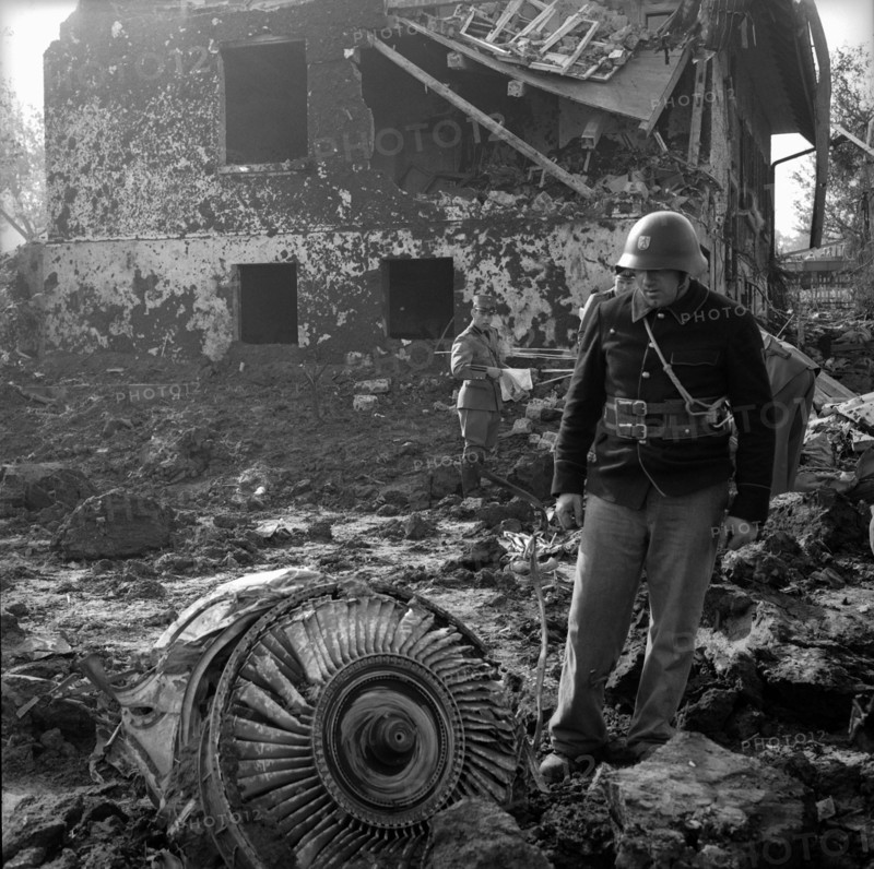 Caravelle crash Durrenasch 1963: fireman looking at remains at the scene of the accident.