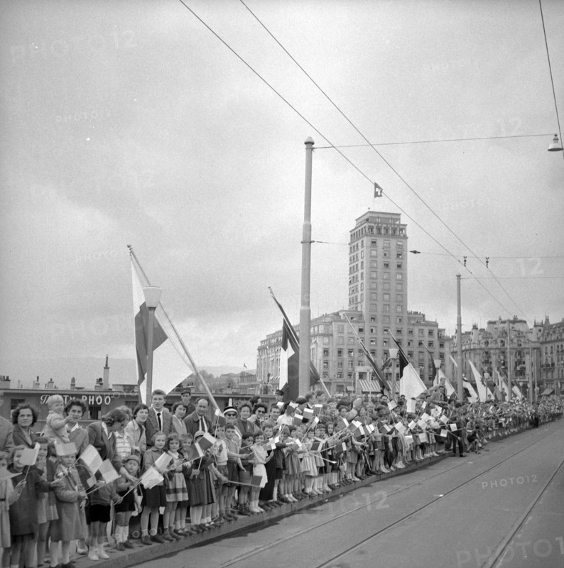 50th anniversary of the Simplon railway tunnel, onlookers waiting roadside in Lausanne 1956.