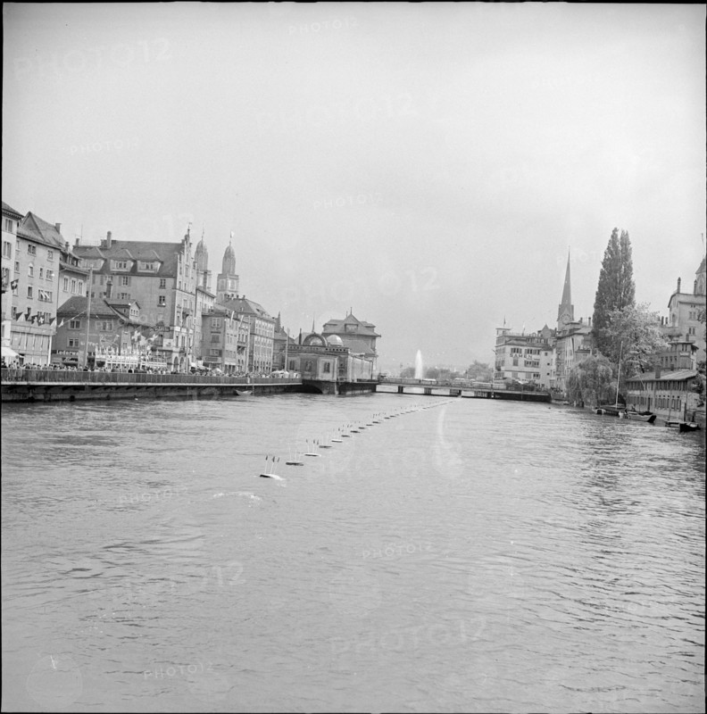 Zurich Festival 1953; fountain in the distance, Limmat river.